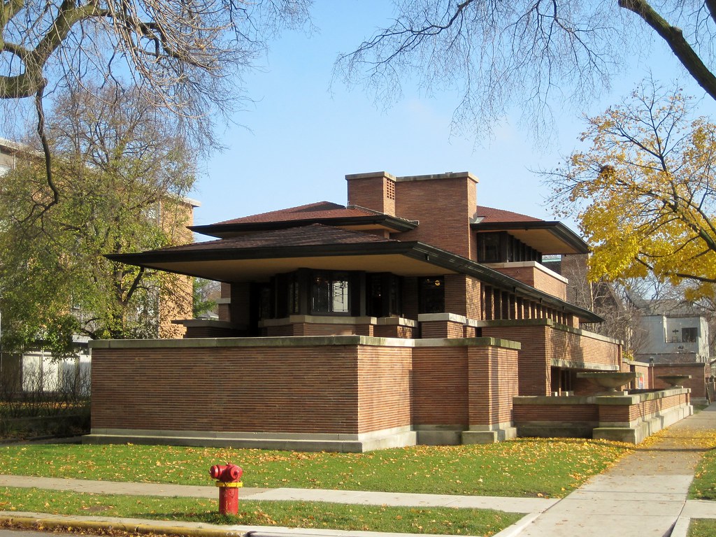 The Frederick C. Robie House, Chicago, Illinois: A large, simple structure with a flat roof. 