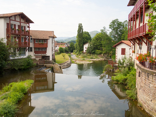 scenery france riverbank architecture heritage french reflections sunshine house old river view site saintjeanpieddeport pyrenees peaceful medieval europe historical travel country landscape village world tourist tourism nive bridge pilgrimage picturesque destination cize buildings waterway