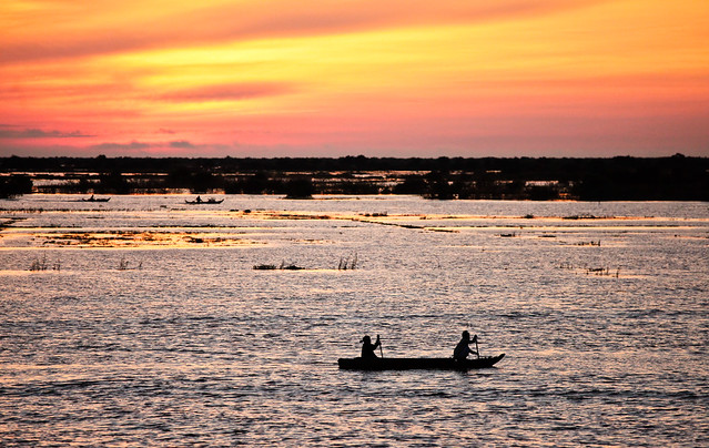 Early morning rowers in Kompong Phhluk, Cambodia