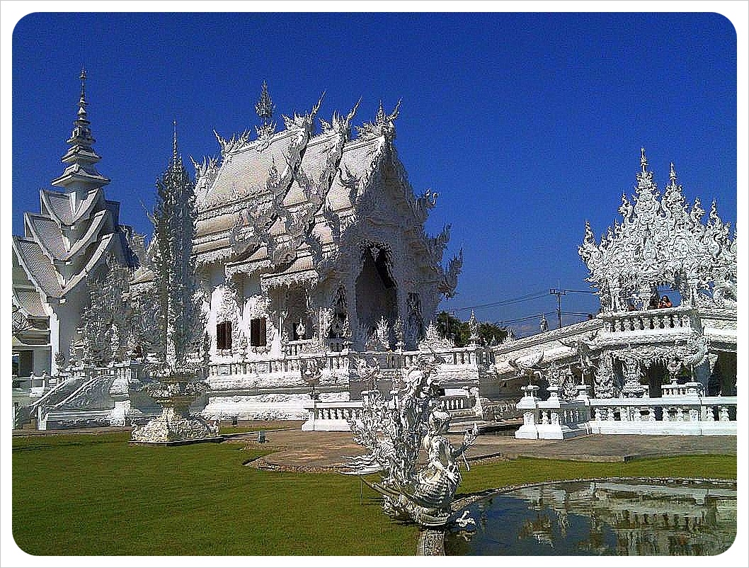 white temple with lake