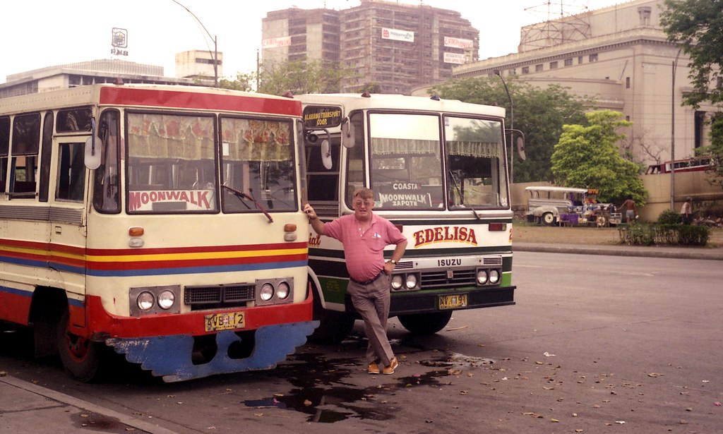 I.D.s 583 & 23747 1990-03-11 of Mini buses NVH-191 and AVB-112 with John Ward in the Lawton layover area of Manila, Philippines.