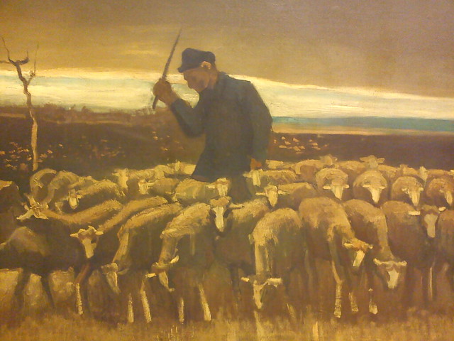 Pastor con un rebaño de ovejas