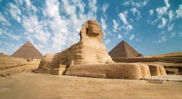 Egypt Giza Sphinx with pyramids in the background