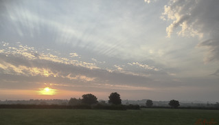 Sunrise, Rays, Mist and Clouds