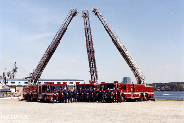Firefighters and new E-One Hush Aerials, 1992