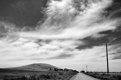 road sky bw cloud weather clouds rural mono spring nikon skies farm hill australia monotone victoria powerlines lane vic powerline dirtroad gravelroad carisbrook centralvictoria d5100 nikond5100 phunnyfotos
