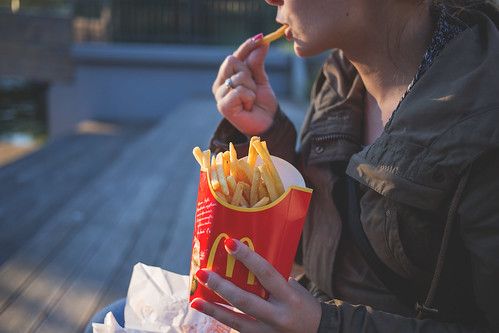 Girl eating french fries