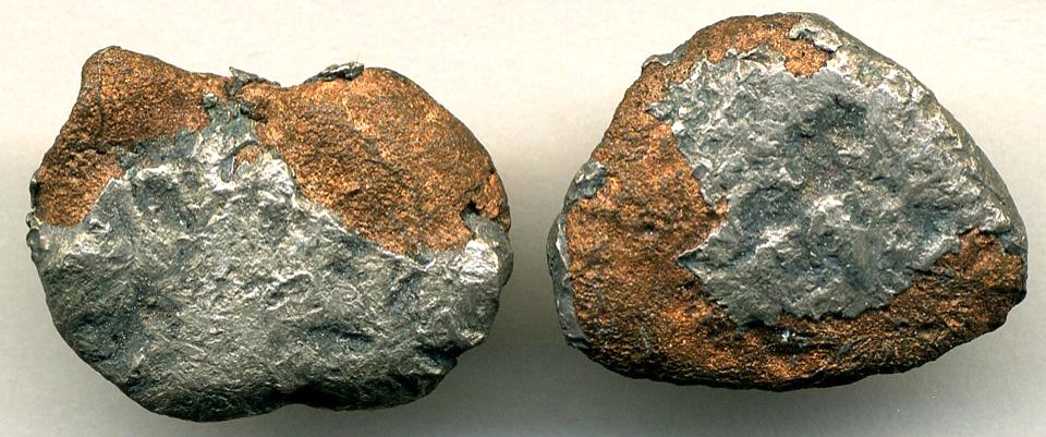 Copper-silver halfbreeds (mill stampings) (Portage Lake Volcanic Series, late Mesoproterozoic, 1.05 to 1.06 Ga; Caledonia Mine, Upper Peninsula of Michigan, USA)