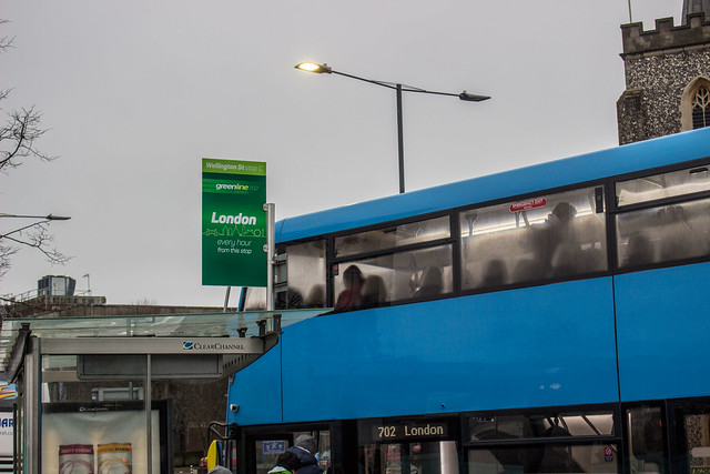 Close up on Green Line's branding in Slough town centre