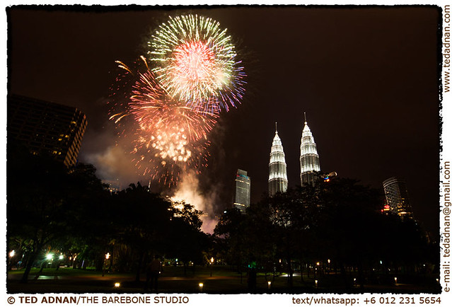 Fireworks display ushering the 2013 New Year near the Petronas Towers in Kuala Lumpur at the stroke of midnight