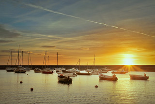Sunrise over the harbour wall