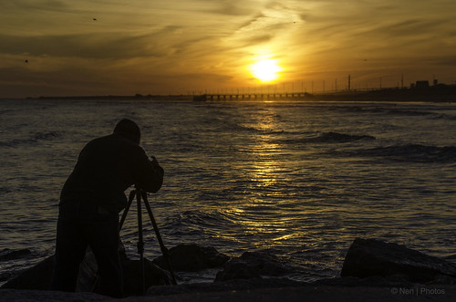 camera sunset sea people usa beach water silhouette landscape texas photographer tripod quintanabeach