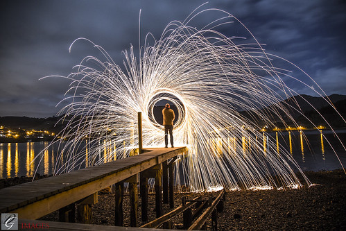wire wool spinning jetty boatshed port chalmers dunedin new zealand reflection broken ankle dgimages sky sunset round fire light blue glowstick