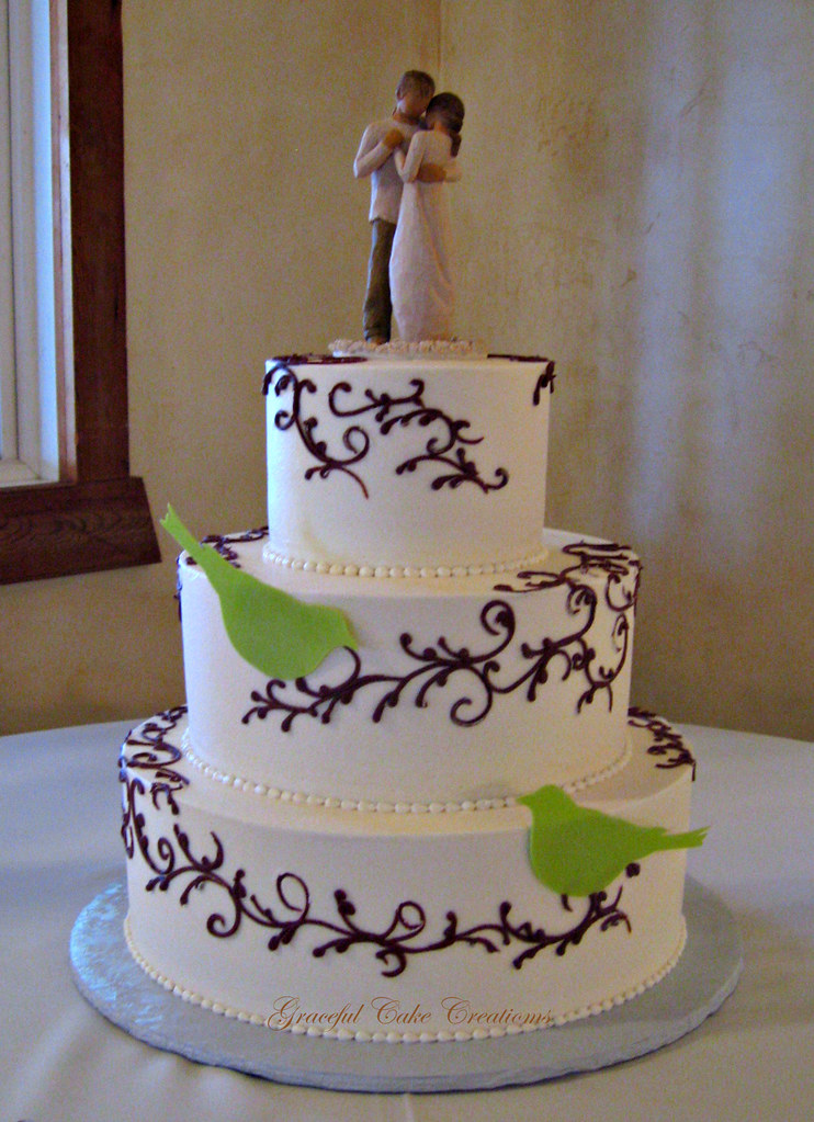 Simple and Elegant Ivory Buttercream Wedding Cake with Brown Scrolls and Green Birds