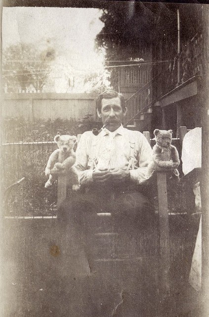Man with pipe and his teddy bears