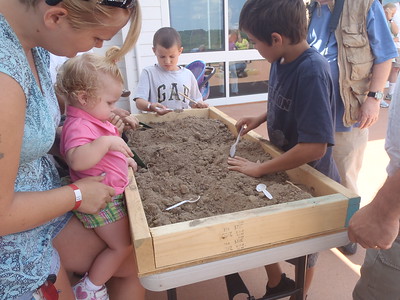  A Family doing a mock Archeology Dig