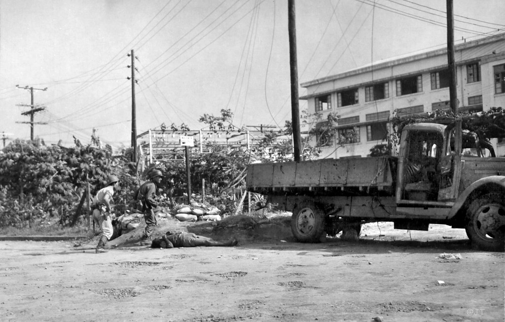 A Filipino and American soldier running for cover as a Jap… | Flickr
