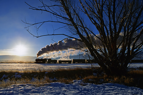Bright sunrise by Moffat Road, Union Pacific 618 silhouetted against a bright sunrise, leads a freight train on February 8, 2006, a