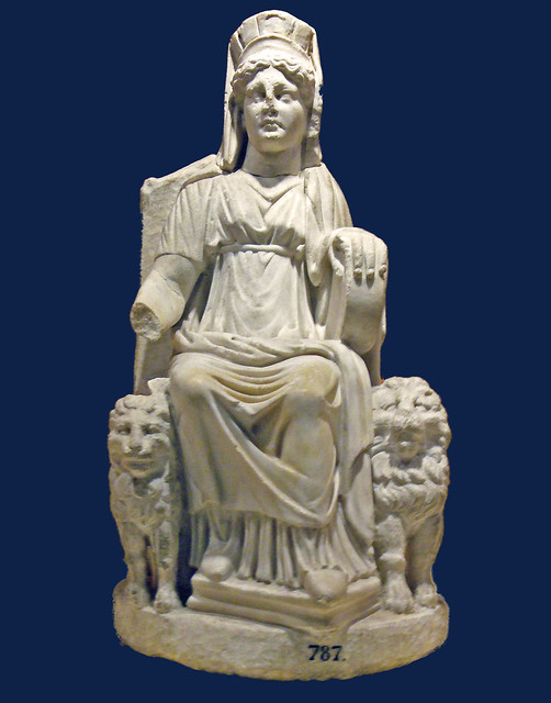 Cybele (magna mater) with a turreted crown and a tympanum in her left hand, flanked by two lions