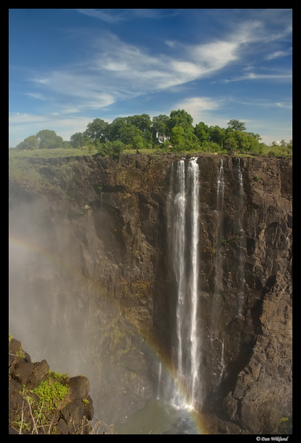 A rainbow at the bottom of the falls