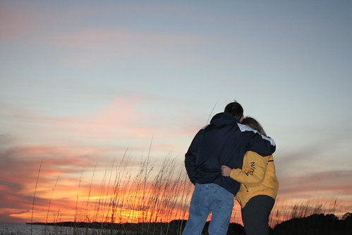 Happiness by J Perry Nelson, A couple holding each other while watching a beautiful Florida sunsettravel winter sunset vacation l