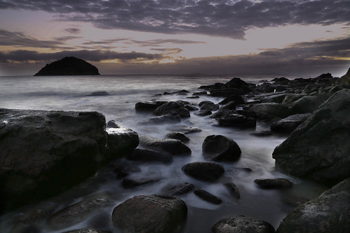 beach water sunrise dawn rocks