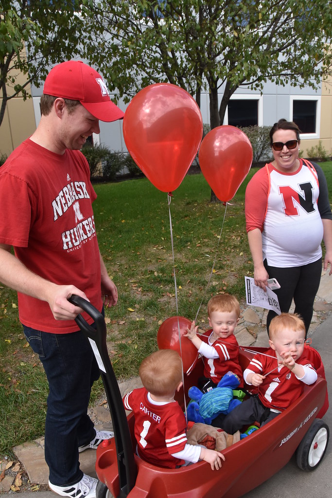 Getting them started young...triplets at a Nebraska football game