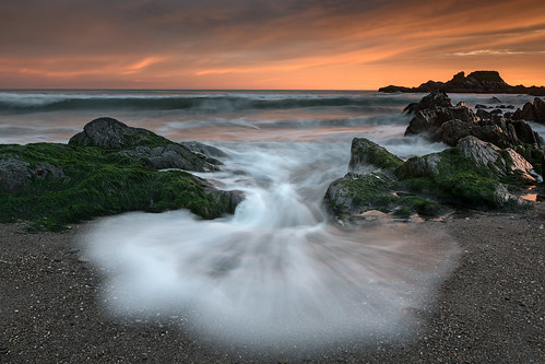 longstrand sunset water wave rocks beach movement cork west