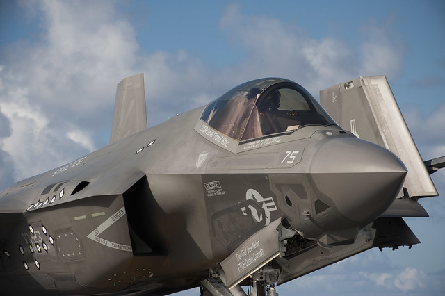 Navy pilot taxis in an F-35C Lightning II carrier variant, on the flight deck of the USS George Washington.