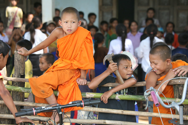 Boy Monks clad in orange robes Northern Laos Asia