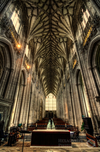 HDR down the nave of Winchester Cathedral. The building was consecrated in 1093. Under William of Wykeham (1367-1404) the Romanesque nave was transformed, recased in Caen stone and remodelled in the Perpendicular style.