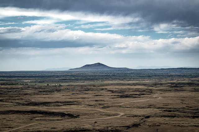 Looking North from the top of Tabernacle Hill. The tabernacle lave field, full of lava tubes, and, in the distance, Pahvant Butte, a butte formed by an extinct volcano. .