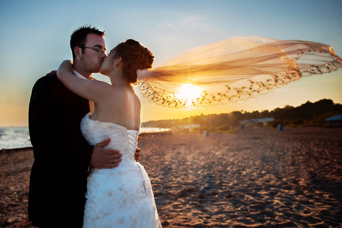 wedding sunset canada beach groom bride kiss lakeerie marriage husband vail wife portstanley destinationwedding destinationweddingphotographer