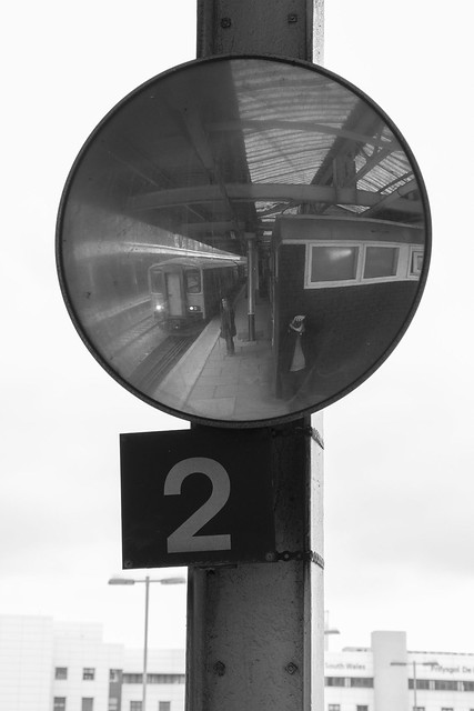 Mirror image: train and photographer at Cardiff Queen St.