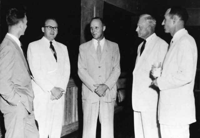 Governor Ford Elvidge, Governor of Guam from 1953 – 1956, shown here fourth from the left, attends an event with four unidentified men. Using his experience as a lawyer, he was able to negotiate with the naval authorities an agreement to increase power and water allocations for the general public. Courtesy of the Micronesian Area Research Center (MARC).