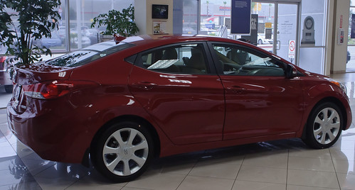 A Red Hyundai inside the dealership waiting for its new owner