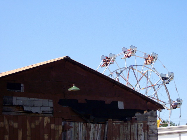 Ferris Wheel And Old Building.