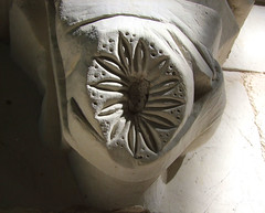 flower carved in place of defaced head