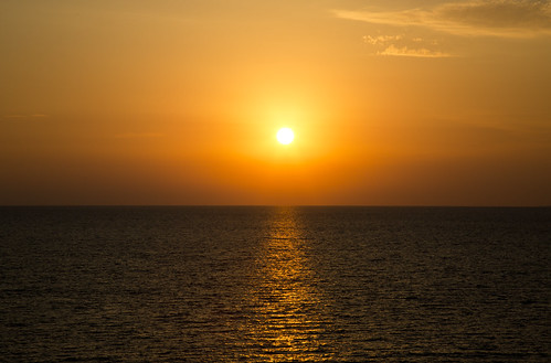 Sunset by Duccio Teufel, sunset sun sea mediterranean water red orange shadow backlight menorca cueva apertif spain balearici