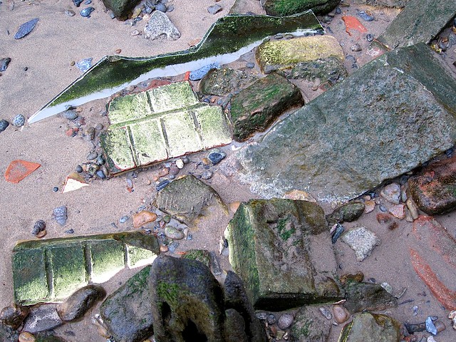 Bricks on the shore by Convoys Wharf