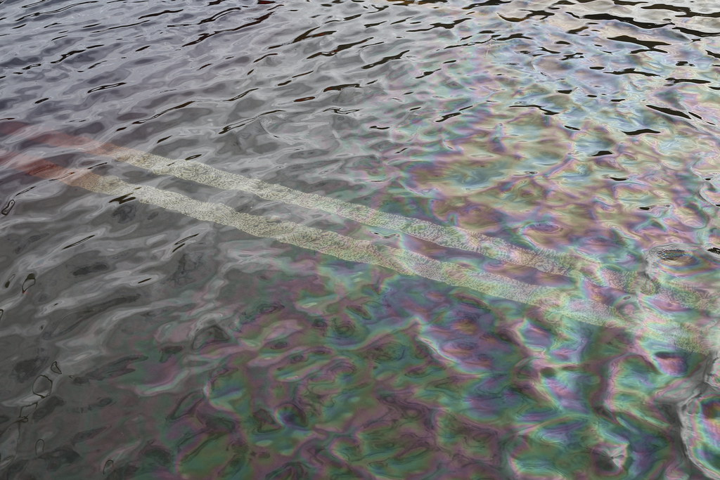 Petroleum sheen on flooded roadway of Battery Park Underpass, after Hurricane Sandy
