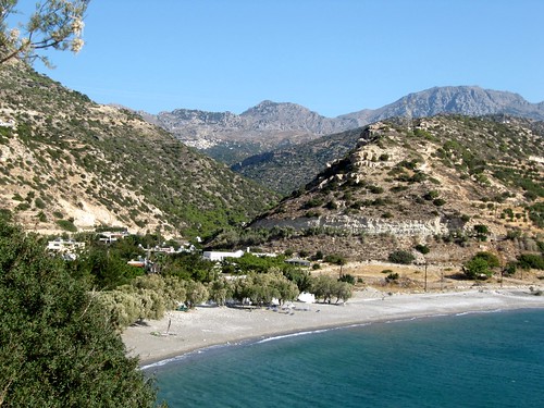 Avra beach and up on the mountain slope the village Aghios Ioannis.