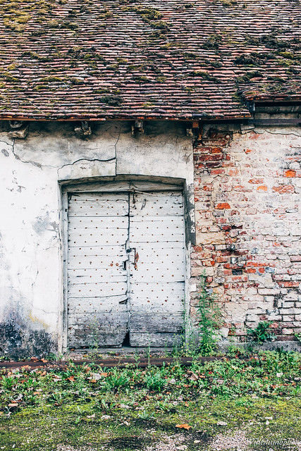 Old door, weathered building
