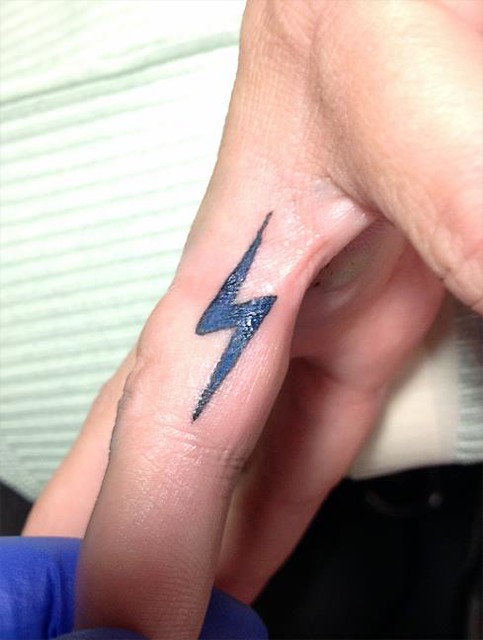 Lightning Bolt Inner Finger Tattoo.