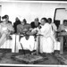 Public Meeting at the Ramakrishna Mission, Delhi. November 30, 1957. Dr. Babu Rajendra Prasad presiding over the meeting along with dignitaries. Swami Ranganathananda showing temple inauguration photo album to the President.