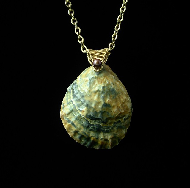 Shell pendant with pearls and brass (front)