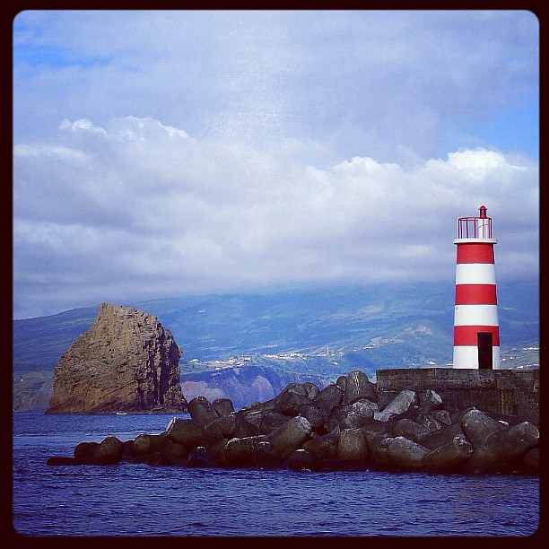 Lighted beacon tower, port of Madalena,Pico Island, Azores