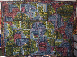 This was actually the second quilt top I ever worked on, but I never finished it. It's not perfect, but sitting on my shelf doesn't do it -- or a friend -- any good.

It will be my 42nd quilt finished, and I'm thinking this is my one chance for a Hitchhiker's-named quilt.