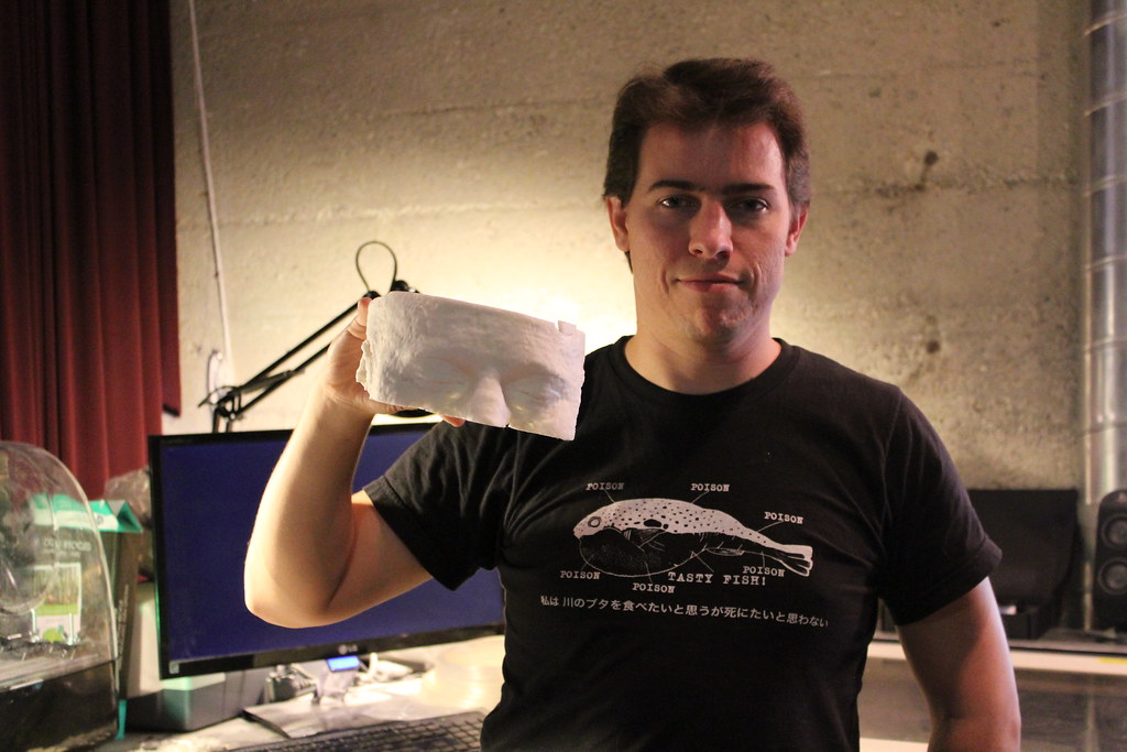 Bryan Jaycox holding a 3D printed skull of himself. - Flickr