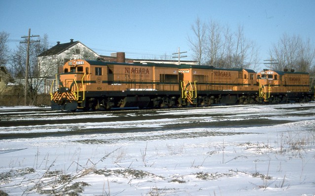 The Niagara & Western New York's entire fleet of power (U18B #404 & #407, GP7 #592) await shipment back to Guilford in the Falls Road Railroad Yard. This tourist operation lasted less than a year.